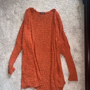 red orange cardigan with front side pockets, never worn, size large